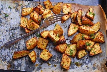 close up of a roasted potato recipe on baking sheet