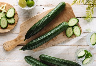 Cucumber sliced on the cutting board, salad ingredient.