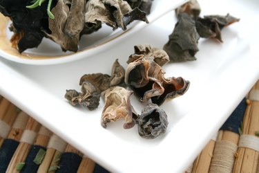 dried black fungus mushrooms on white plate