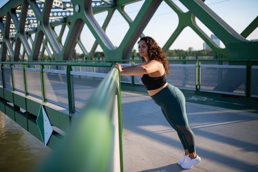 woman doing a wall push-up as one of the best low-impact strength training exercises for diabetes