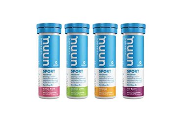 4 tubes of Nuun Sport Electrolyte Drink Tablets on white background