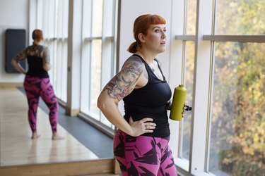 Woman at the gym doing post-workout routine