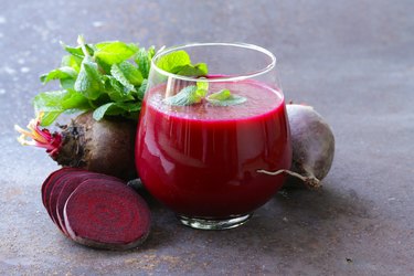 fresh beet juice with mint leaf in a glass