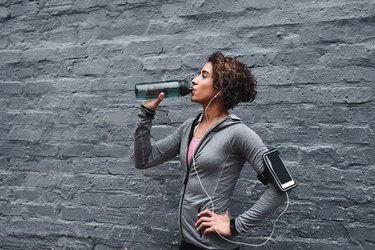 Woman drinking water to stay hydrated