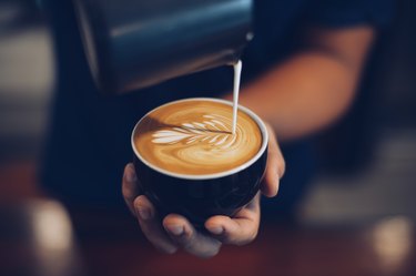 pouring coffee into latte