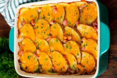 A pan filled with Scalloped Potatoes and Ham