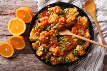 orange chicken in sweet and sour sauce close-up. horizontal