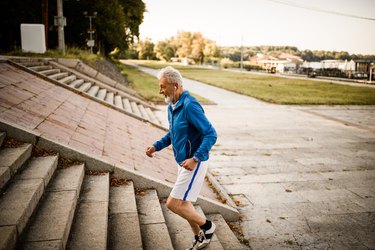 Older man running up steps, as a natural remedy for enlarged prostate