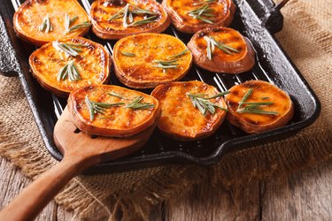 Grilled sweet potato rounds with rosemary on a grill pan