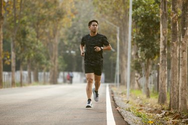 person running outside to demonstrate employing mental strategies to make a run easier