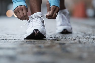 Close up of a person's feet in walking shoes, getting ready to walk 2 miles per day to lose weight